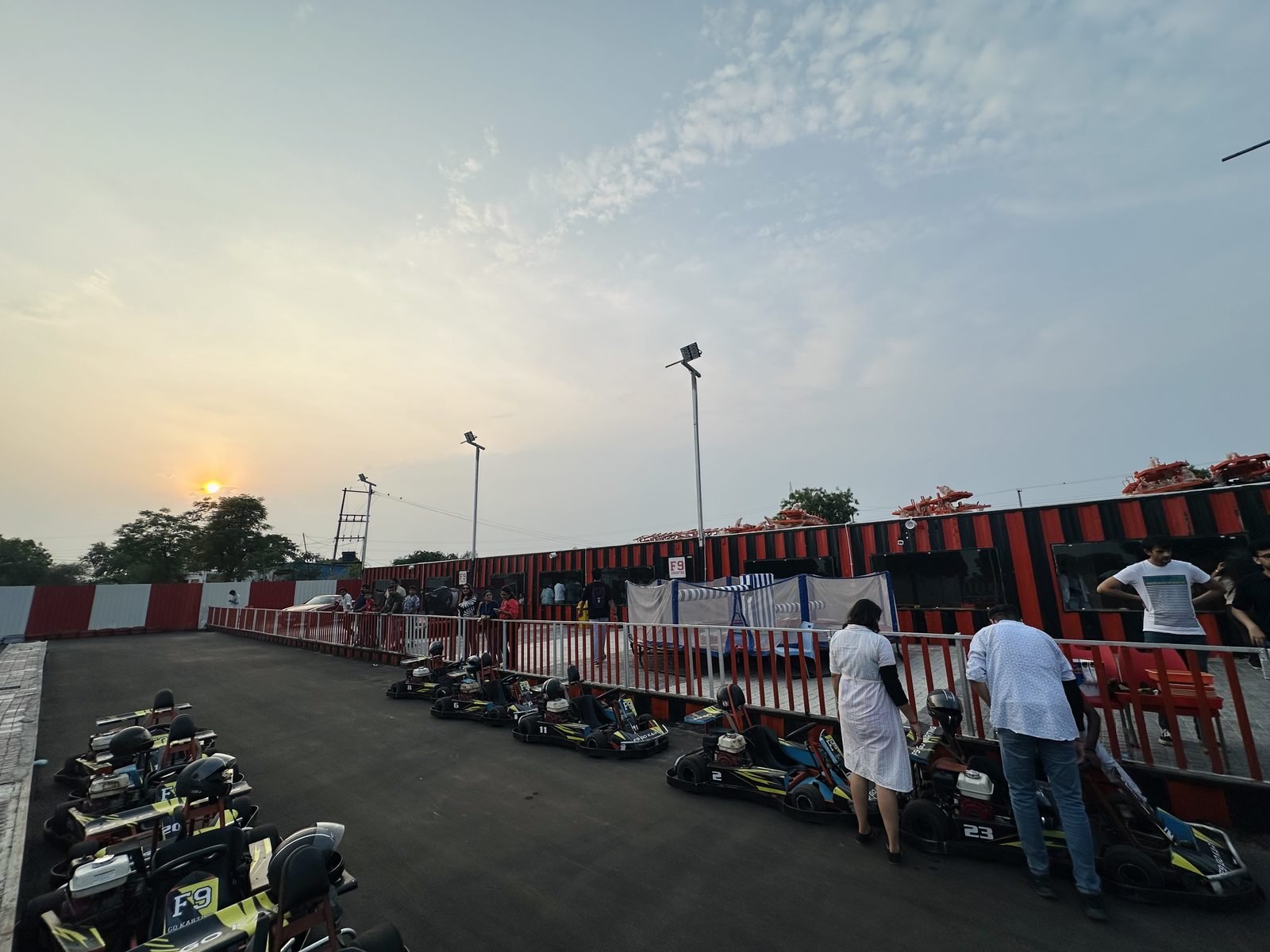 Go karting birthday party cost: a group lined up with karts before a session at an F9 circuit